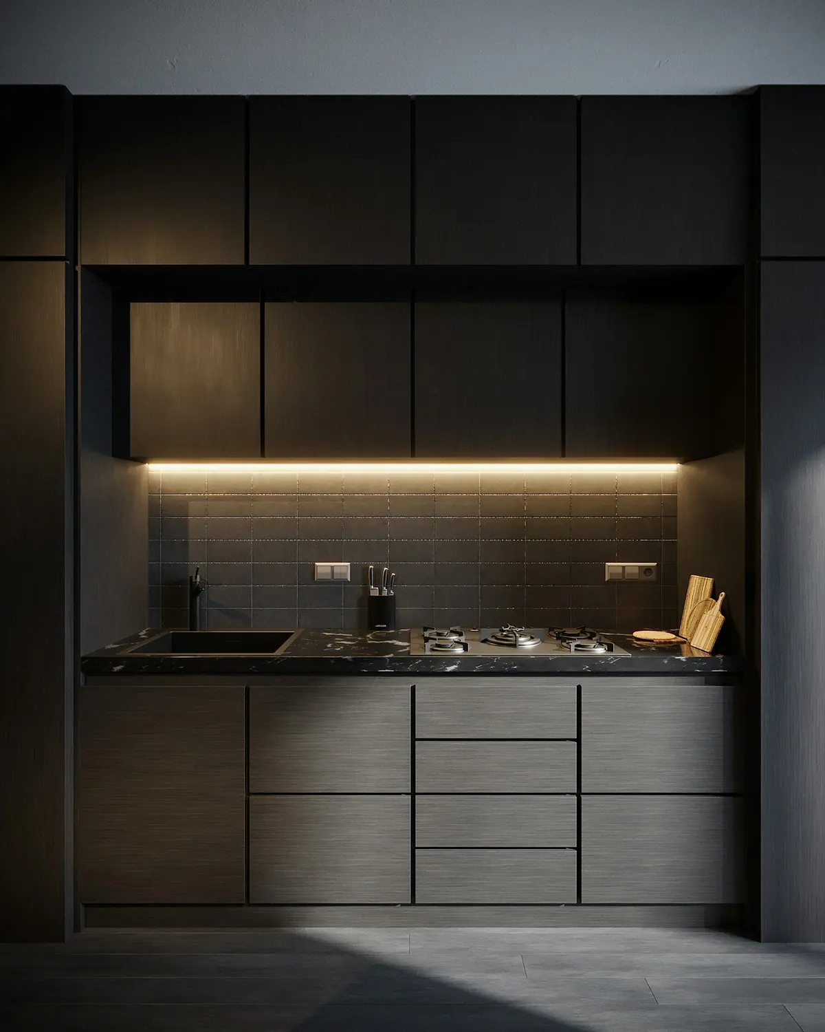 Cozinha planejada em preto fosco com iluminação âmbar sob os armários